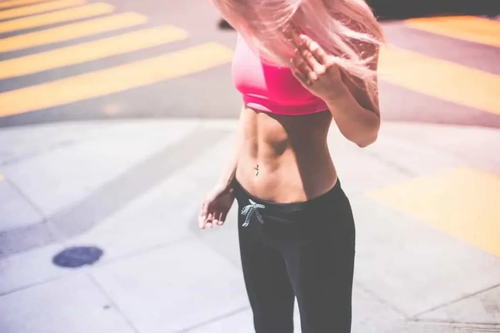 Woman with toned stomach after LA-EMS Body Sculpting Treatment Paisley